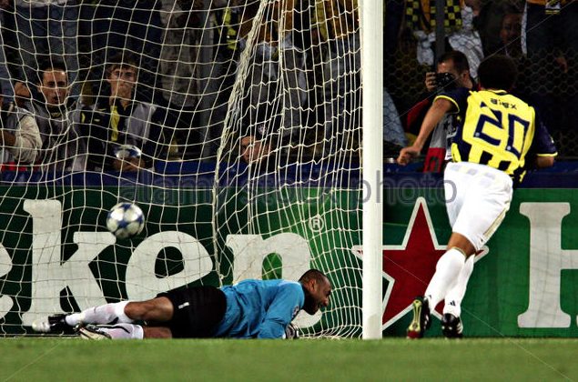 Fenerbahce's De Souza scores against PSV Eindhoven's goalkeeper Gomes from penalty spot during Champions League match in Istanbul